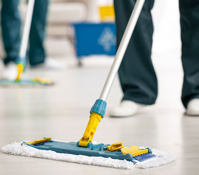 Cleaning crew mopping floors